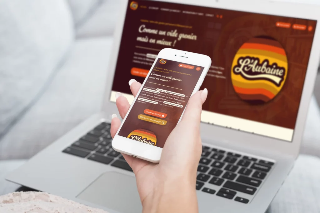 Mockup-pc-et-tel-l_aubaine Site e-commerce L'Aubaine affiché sur ordinateur et mobile — vide-grenier permanent Villeneuve-sur-Lot créé par l'agence Terre Bleue